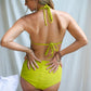 This image features the KAVERI Bikini from Sivani Divine Wear, a beautifully designed swimwear piece that exudes elegance and spirit. A woman showing her back in Kaveri Bikini.