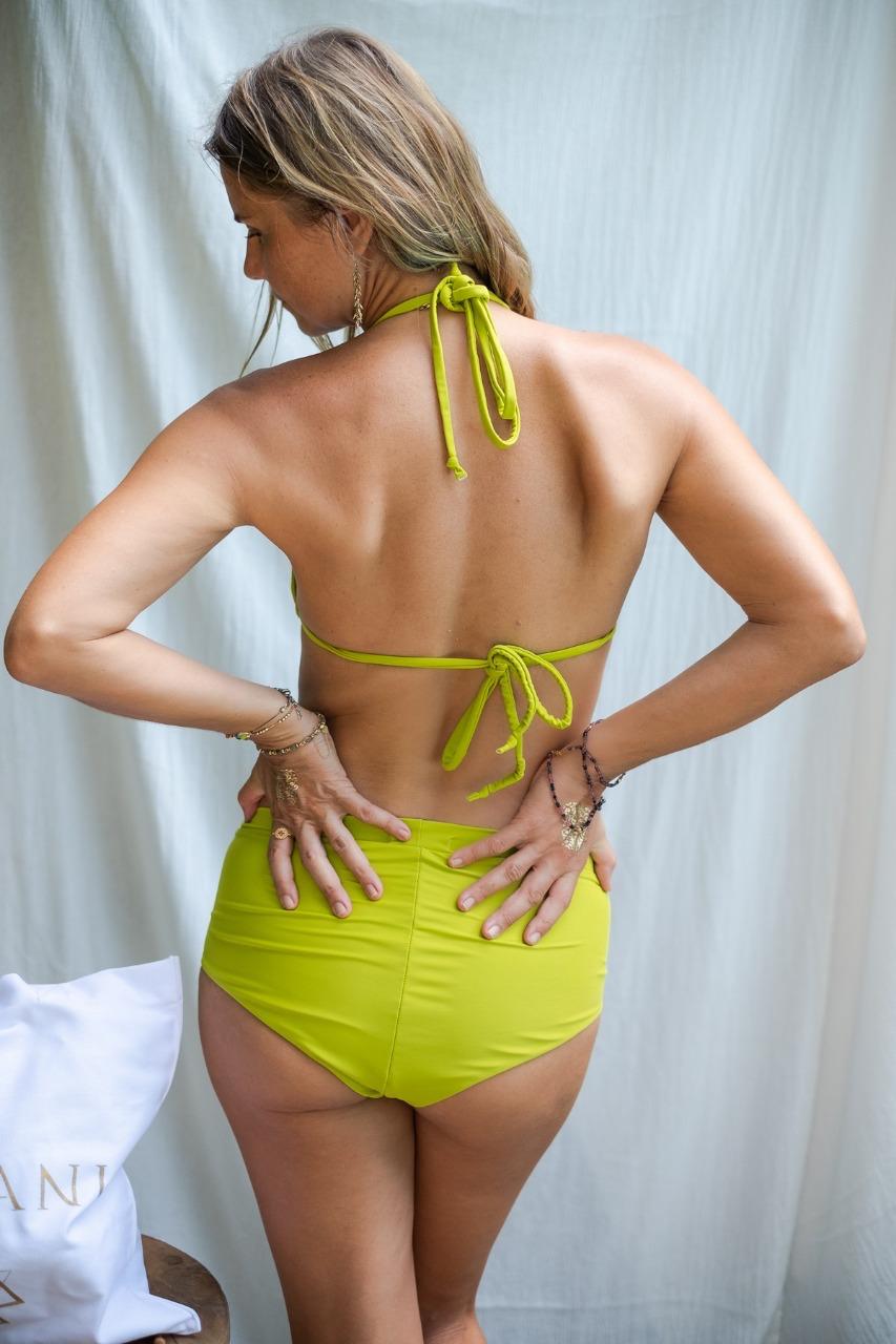 This image features the KAVERI Bikini from Sivani Divine Wear, a beautifully designed swimwear piece that exudes elegance and spirit. A woman showing her back in Kaveri Bikini.